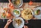 Family fresh dinner with grapefruit juice, pasta and salad