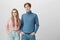 Family, friendship, couple, and relationships concept. Lovely young caucasian boy and girl wearing knitted sweaters and