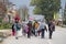 Family in front of a crowd of refugees on their way to register and enter Serbia at the border with Macedonia on Balkans Route