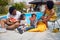 Family Fun Under the Sun: Afro-American Parents and Kids Enjoy a Poolside Watermelon Feast