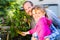 Family in garden harvesting bell pepper