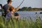 family, generation,holidays and people concept. pleasant granddad and grandson fishing