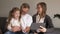 Family, generation, technology and people concept - smiling grandfather, granddaughter and grandmother with tablet