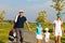 Family of golf players walking