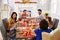 Family With Grandparents Enjoying Thanksgiving Meal At Table