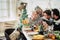 Family group people enjoy lunch together in christmas days season - happy caucasian enjoy food and indoor leisure activity at home