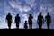 Family group walk for travel under blue sky.