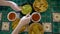 Family hands eating Mexican food corn nachos dipping salsa and avocado guacamole sauce