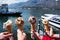 Family hands holding cones of Gelato, Italian ice-cream with blur background of a landscape view of Lake Como in Italy