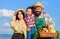 Family happy cheerful farmers gardeners. Family farmers proud of fall harvest. Harvest festival concept. Life in