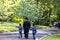 A family of Hasidic Jews, a man with children, is walking along Park