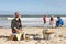 Family Having Barbeque On Winter Beach