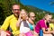 Family having break from hiking in the mountains