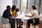 Family Having Consultation With Female Pediatrician In Hospital Office