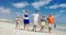 Family having enjoyable walk on the beach