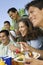 Family Having Food On A Picnic