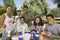 Family Having Food On A Picnic