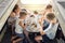 Family having lunch at table in train car in morning