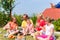 Family having picnic in garden front of their home