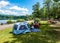 Family having picnic by the lake at Bear Mountain State Park in New York State