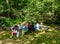 Family having picnic by the lake at Bear Mountain State Park in New York State