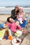 Family Having Picnic On Winter Beach