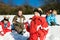 Family having a snowball fight