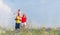 Family having walk on meadow with flowers