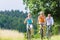 Family having weekend bicycle tour outdoors