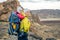 Family hike, mother with baby in backpack