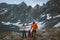 Family hiking in mountains travel adventure active vacations parents with child outdoor