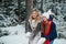 In a family holiday home in the forest, a lovely mother and daughter are resting in winter, enjoying the first snow