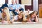 Family at home, the children coloring on floor