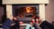 Family at home. Feet in socks near fireplace. Winter holiday concept