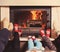 Family at home. Feet in socks near fireplace. Winter holiday concept