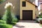 Family house garage driveway with stone tiles and tall narrow Pampas grass or Cortaderia selloana perennial flowering plant