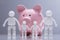 Family Human Figures Standing In Front Of Pink Piggy Bank