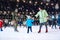 Family on the ice skating rink.