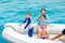 Family in inflatable dinghy boat