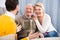 Family joyfully talking at home