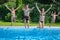 Family jump to swimming pool