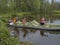 Family in kayak. Active extreme holidays in Karelia. Ecotourism, visiting fragile, pristine, and relatively undisturbed natural