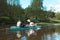 Family kayak trip. An elderly married couple rowing a boat on the river, a water hike, a summer adventure. Age-related sports,