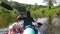 Family kayak trip. Mom and daughter rowing a boat on the river, a water hike, a summer adventure. Eco-friendly and extreme tourism