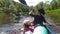 Family kayak trip. Mom and daughter rowing a boat on the river, a water hike, a summer adventure. Eco-friendly and extreme tourism