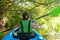 Family kayaking, child paddling in kayak on river canoe tour, kid on active autumn weekend and vacation, sport and fitness