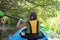 Family kayaking, child paddling in kayak on river canoe tour, kid on active autumn weekend and vacation, sport and fitness