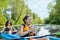 Family kayaking, mother and child paddling in kayak on river canoe tour having fun, active weekend and vacation, fitness co