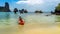 Family kayaking, mother and daughter paddling in kayak on tropical sea canoe tour near islands, having fun, active vacation