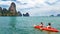 Family kayaking, mother and daughter paddling in kayak on tropical sea canoe tour near islands, having fun, active vacation